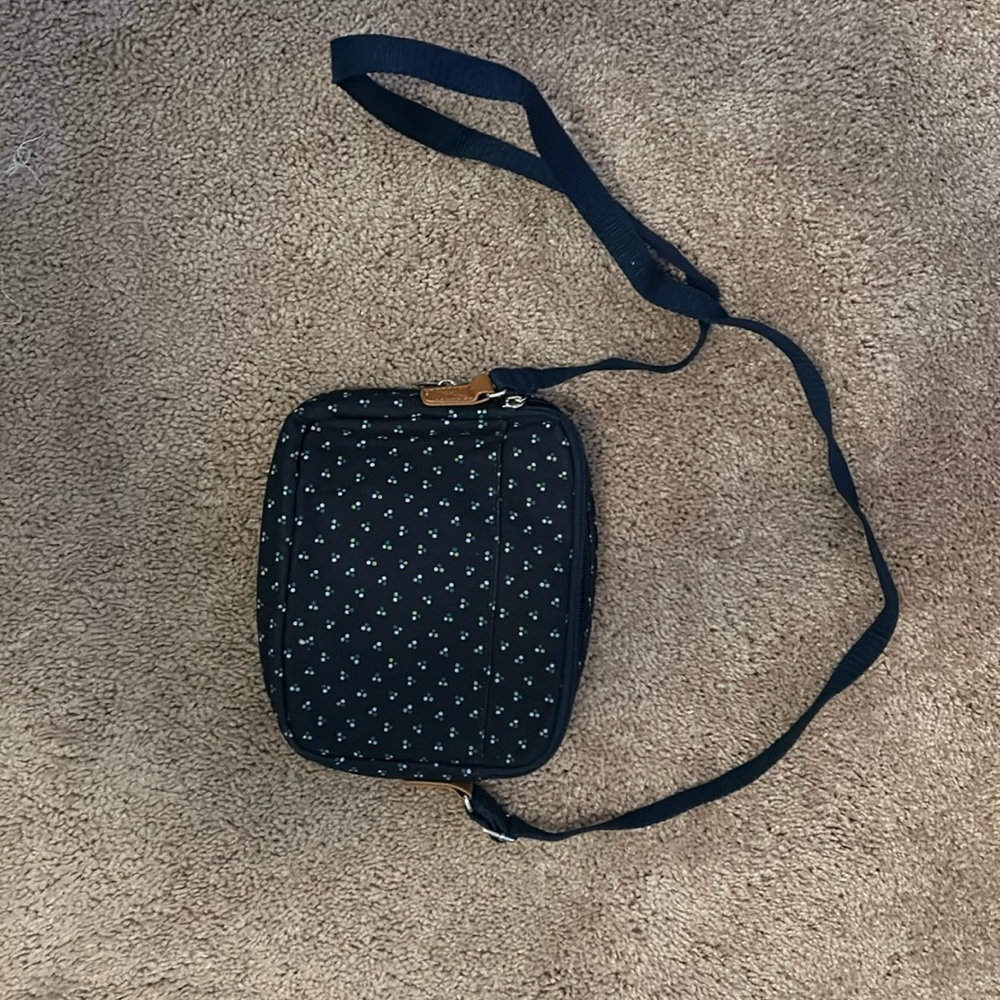 Taken out of the plastic to show people the purse during a Thirty-one party